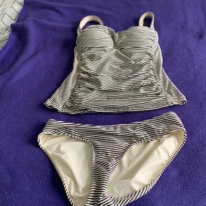 Black and white 2 piece swim suit. Tags removed but never worn.